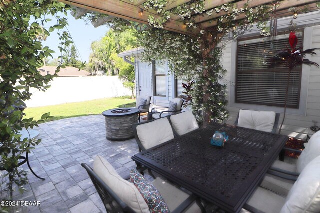 view of patio featuring a fire pit