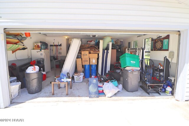 garage featuring white fridge