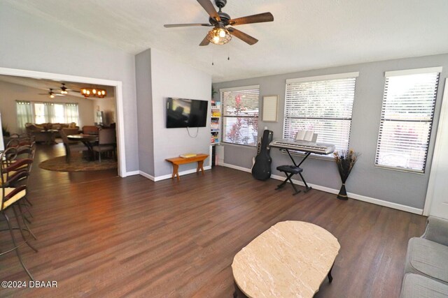 interior space featuring lofted ceiling, dark hardwood / wood-style floors, and ceiling fan