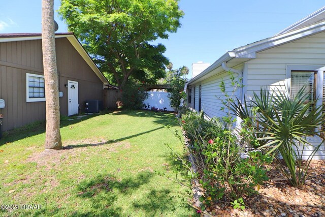 view of yard with central AC