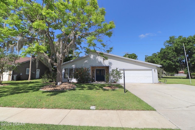 ranch-style home with a garage and a front yard