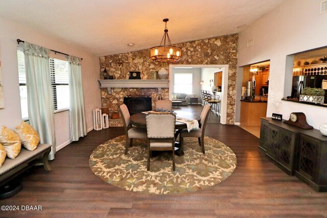 dining area with dark hardwood / wood-style flooring and lofted ceiling