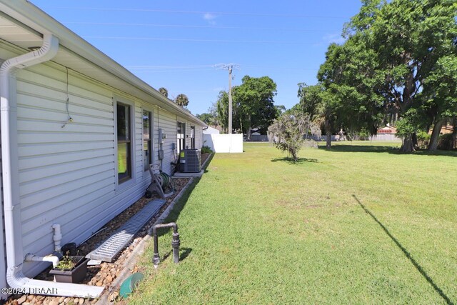 view of yard featuring central AC