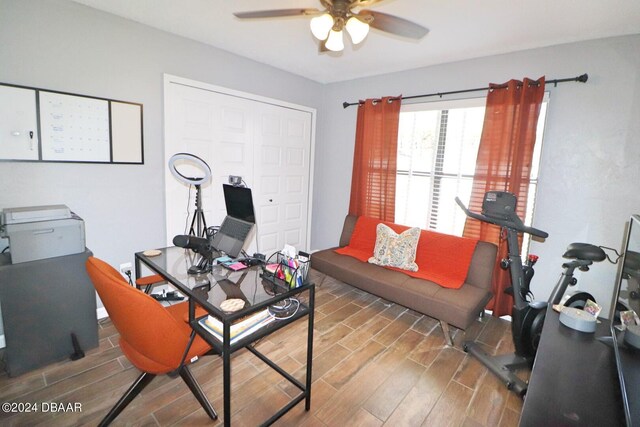 office with hardwood / wood-style flooring and ceiling fan