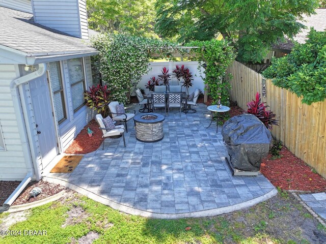 view of patio / terrace with an outdoor fire pit