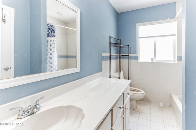 bathroom with tile walls, tile patterned flooring, vanity, and toilet