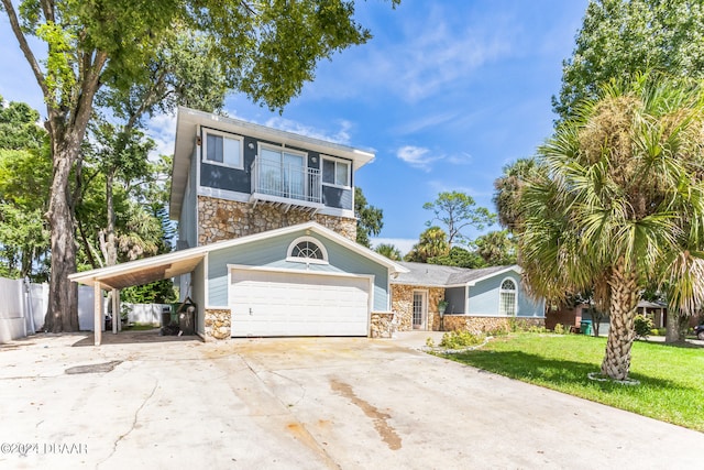 view of front of home featuring a front lawn, a garage, and a carport