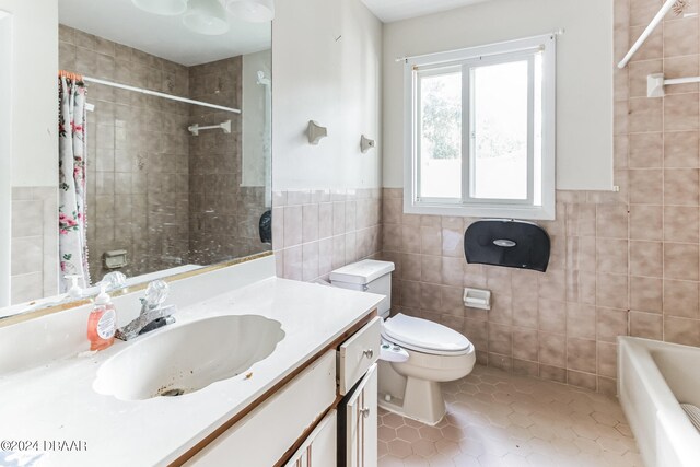 full bathroom with tile walls, tile patterned flooring, vanity, and toilet