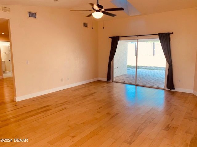 empty room with light hardwood / wood-style floors and ceiling fan