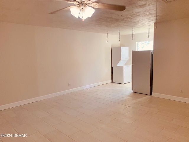 spare room with ceiling fan