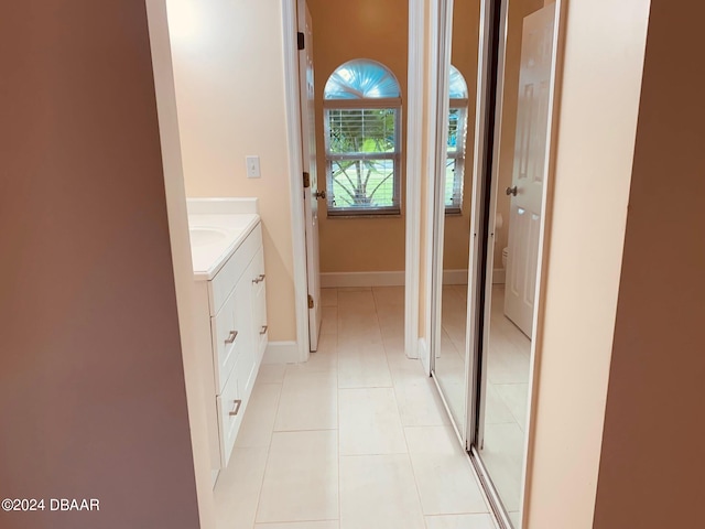 bathroom with tile patterned flooring and vanity