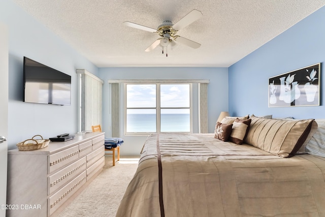 1183 Ocean Shore Blvd Unit 5050, Ormond Beach, FL 32176 - bedroom featuring a textured ceiling, carpet flooring, and ceiling fan