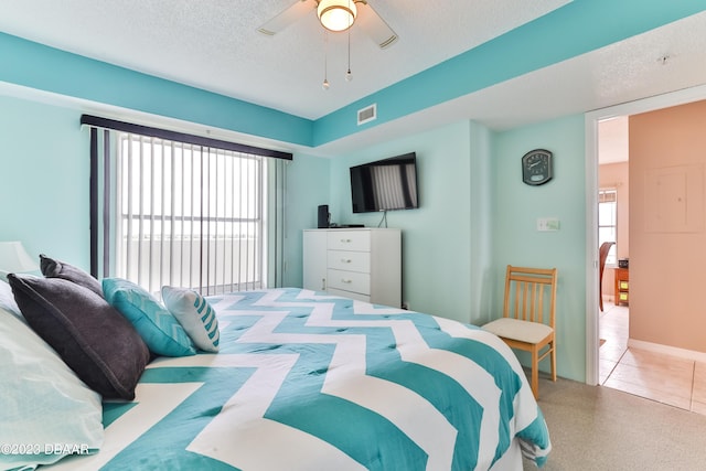 1183 Ocean Shore Blvd Unit 5050, Ormond Beach, FL 32176 - bedroom with carpet floors, ceiling fan, and a textured ceiling
