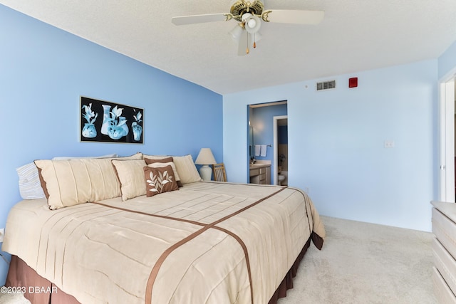 1183 Ocean Shore Blvd Unit 5050, Ormond Beach, FL 32176 - carpeted bedroom with ceiling fan and connected bathroom