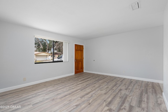 empty room featuring light hardwood / wood-style floors