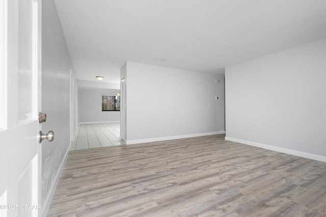 unfurnished room featuring light wood-type flooring