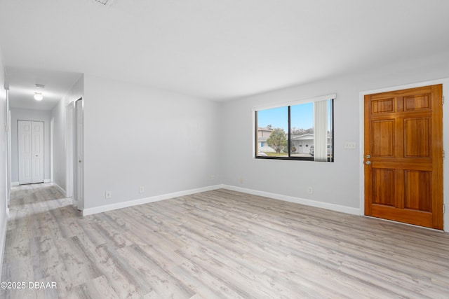 spare room featuring light hardwood / wood-style floors