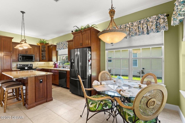 3428 Rexford Cir, Ormond Beach, FL 32174 - kitchen with appliances with stainless steel finishes, a sink, plenty of natural light, crown molding, and decorative backsplash