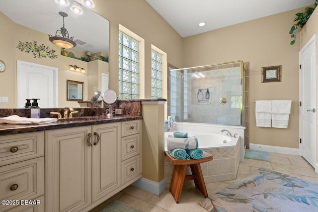 3428 Rexford Cir, Ormond Beach, FL 32174 - bathroom with a tile shower, a bath, vanity, tile patterned floors, and baseboards