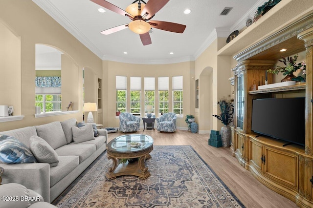 3428 Rexford Cir, Ormond Beach, FL 32174 - living area featuring arched walkways, ceiling fan, recessed lighting, light wood finished floors, and ornamental molding