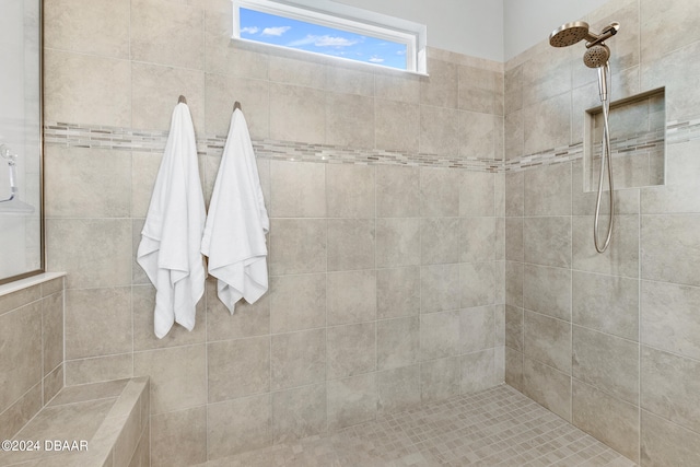 bathroom featuring tiled shower