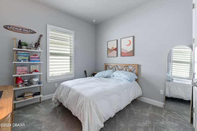 bedroom featuring dark carpet