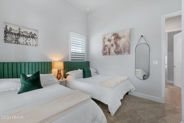 bedroom with hardwood / wood-style flooring