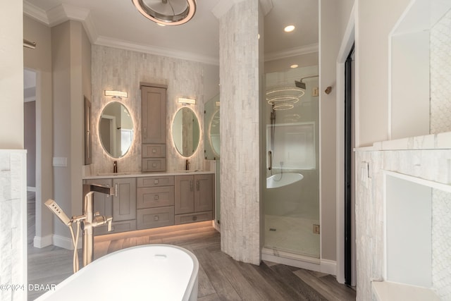 bathroom with wood-type flooring, vanity, shower with separate bathtub, and ornamental molding