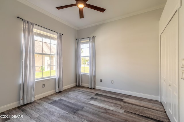 unfurnished room featuring ceiling fan, light hardwood / wood-style flooring, and crown molding