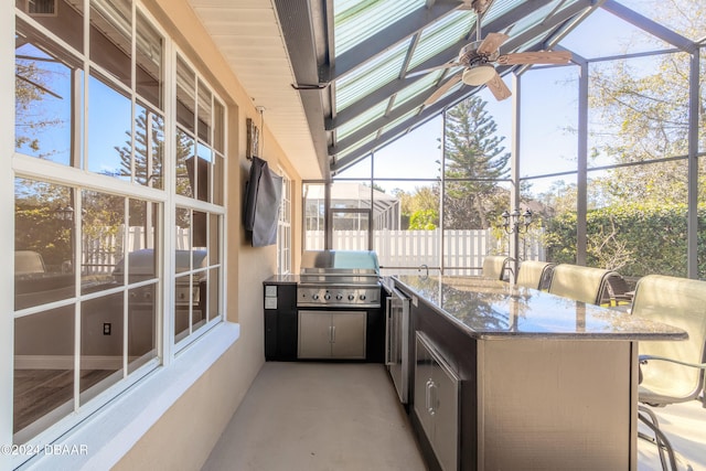 view of patio / terrace featuring a bar, grilling area, a lanai, and ceiling fan