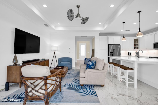 464 Tropics Ave, Daytona Beach, FL 32124 - living room with recessed lighting, crown molding, a tray ceiling, and light marble finish floors