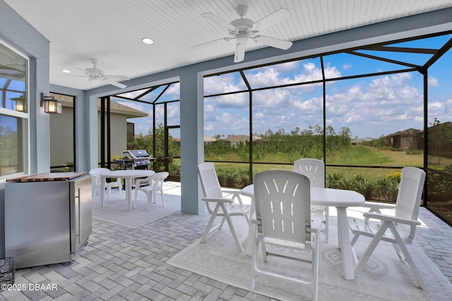 464 Tropics Ave, Daytona Beach, FL 32124 - sunroom / solarium featuring ceiling fan and outdoor dining space