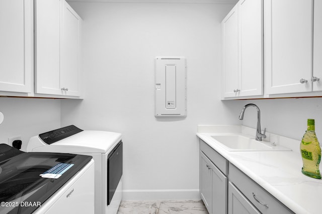 464 Tropics Ave, Daytona Beach, FL 32124 - laundry area featuring cabinet space, baseboards, light marble finish floors, separate washer and dryer, and electric panel