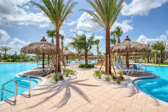 464 Tropics Ave, Daytona Beach, FL 32124 - community pool featuring a gazebo and a patio