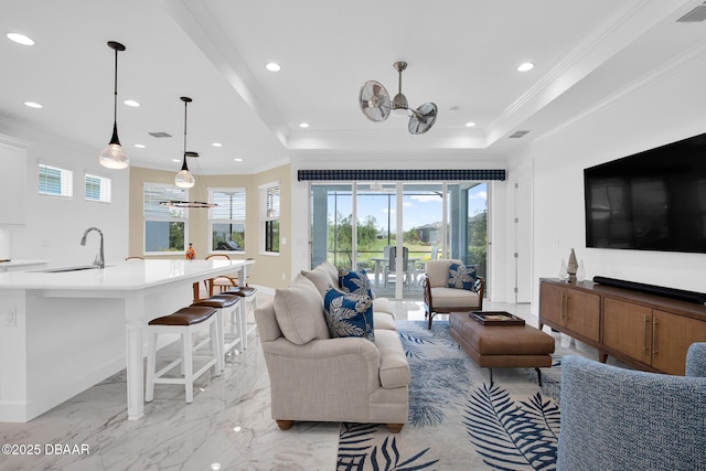 464 Tropics Ave, Daytona Beach, FL 32124 - living area with crown molding, healthy amount of natural light, recessed lighting, light marble finish flooring, and a tray ceiling