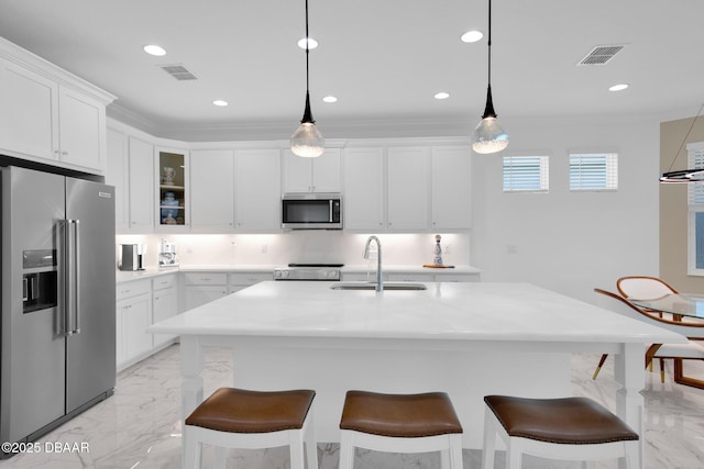 464 Tropics Ave, Daytona Beach, FL 32124 - kitchen with appliances with stainless steel finishes, a sink, light marble finish floors, a kitchen breakfast bar, and ornamental molding