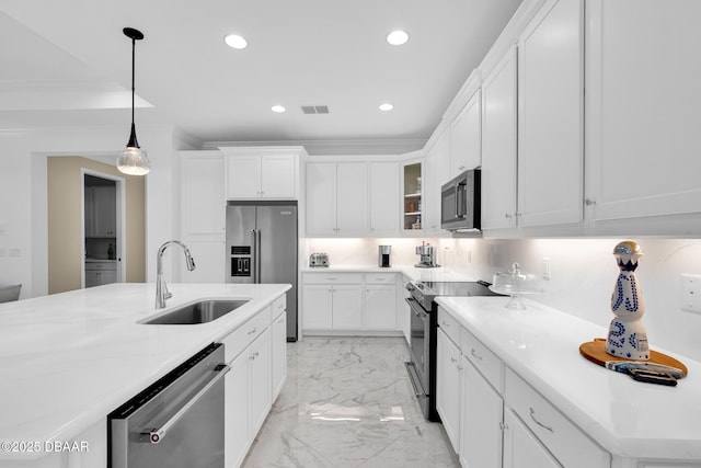 464 Tropics Ave, Daytona Beach, FL 32124 - kitchen featuring stainless steel appliances, a sink, light marble finish flooring, recessed lighting, and white cabinets