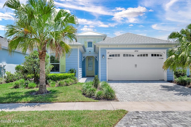 464 Tropics Ave, Daytona Beach, FL 32124 - view of front of home featuring driveway and a garage