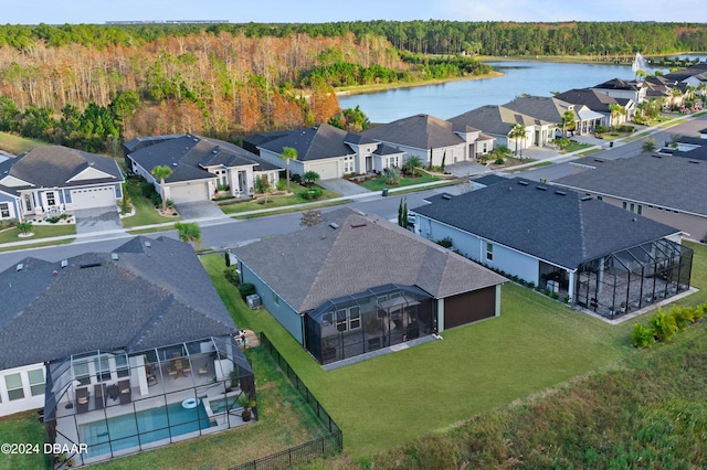 birds eye view of property with a water view