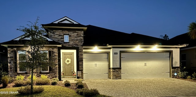 540 Mosaic Blvd, Daytona Beach, FL 32124 - view of front of property with stone siding, driveway, a garage, and stucco siding