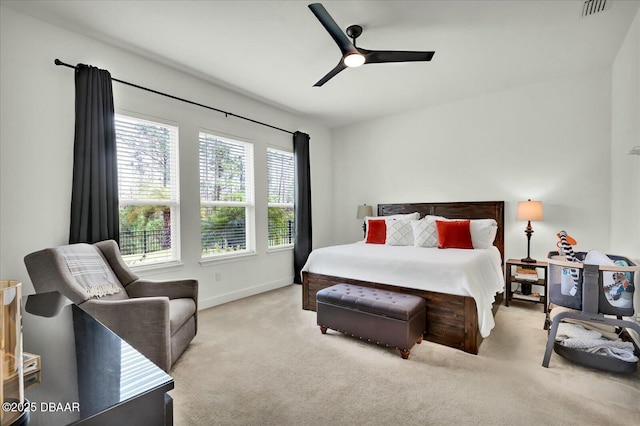 bedroom featuring baseboards, carpet flooring, a ceiling fan, and visible vents