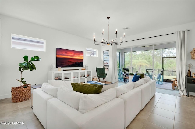 living area featuring visible vents, an inviting chandelier, and light tile patterned flooring