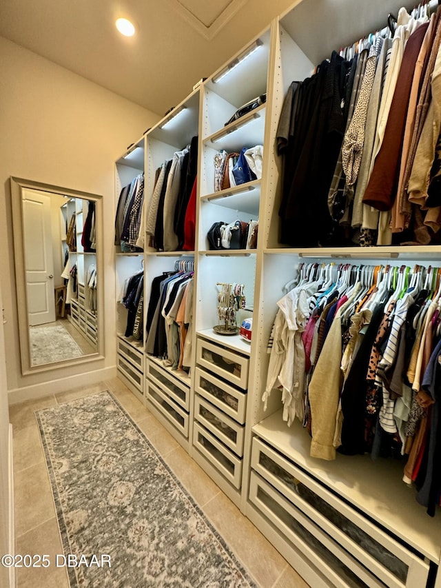 spacious closet featuring tile patterned floors