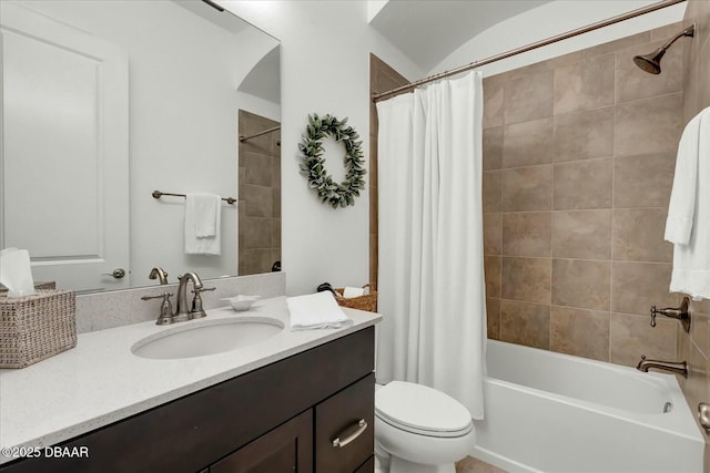 full bath featuring toilet, vanity, and shower / bath combination with curtain