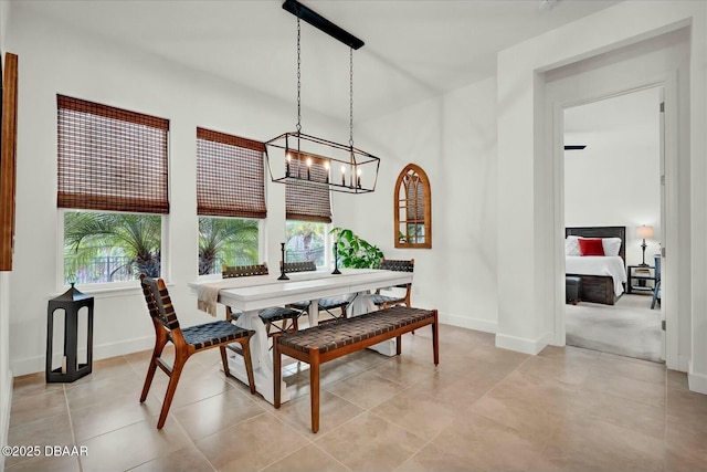 dining area featuring a wealth of natural light, baseboards, and light tile patterned flooring