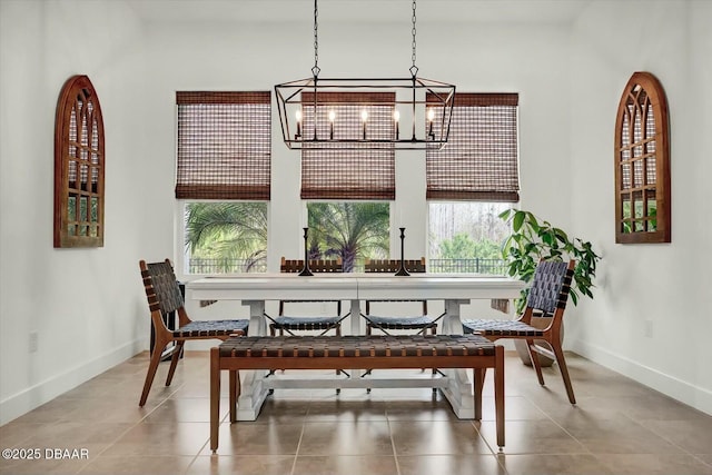 dining area with tile patterned floors and baseboards