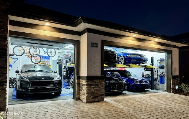 view of garage at night