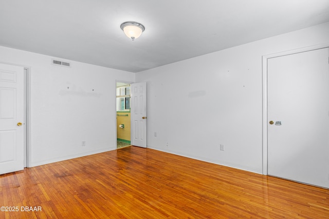 1104 Jacaranda Ave, Daytona Beach, FL 32118 - unfurnished bedroom with wood finished floors