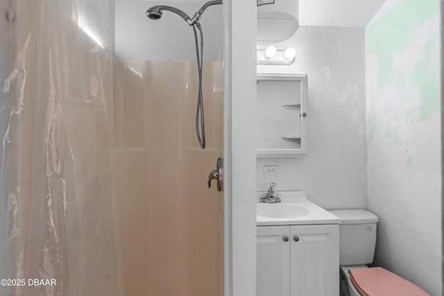 1104 Jacaranda Ave, Daytona Beach, FL 32118 - bathroom featuring a textured wall, vanity, and a shower with shower curtain