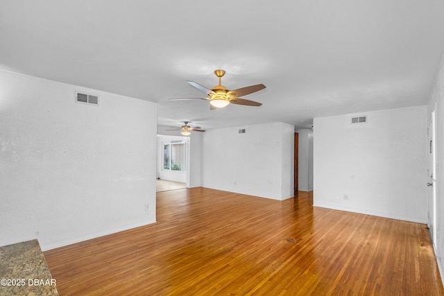 1104 Jacaranda Ave, Daytona Beach, FL 32118 - unfurnished living room featuring a ceiling fan and light wood-style flooring